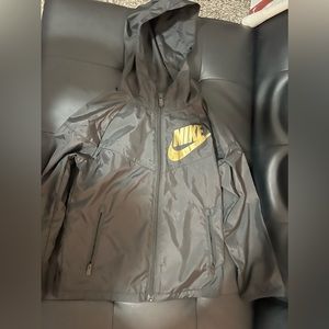Black NIKE Windbreaker with Gold NIKE check. Kids. Size 7 (large)